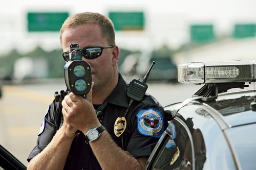 Police officer shooting laser