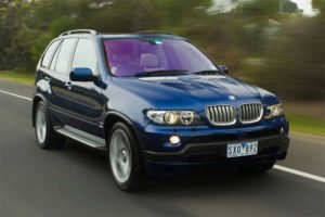 BMW with metallic tinted windshield and purple coating ...